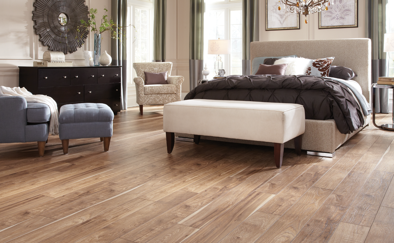 Wood look tile plank in the bedroom, medium finish white bed 