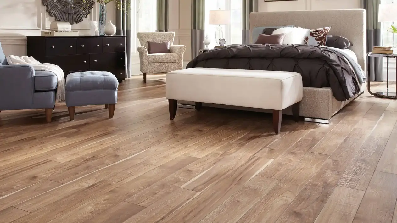 Wood look tile plank in the bedroom, medium finish white bed 