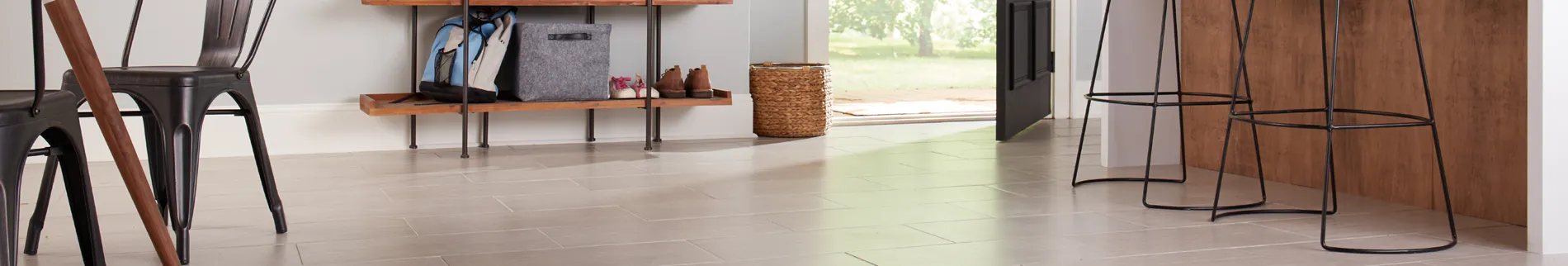 tile kitchen with breakfast bar and stools 